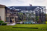 Get An Unparalleled Pool Experience with a Pool Screen Enclosure