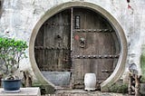 Unusual circular door with the appearance of a treasure vault.
