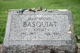 The headstone of artist Jean-Michel Basquiat