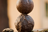 two metallic balls on top of each other — symbol for balance, simplicity, zen