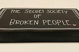 THE SECRET SOCIETY OF BROKEN PEOPLE