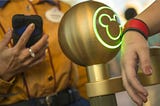 Guest tapping into a Disney park using their Magic Band