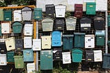 A colorful collection of mailboxes.