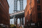 Washington Street in DUMBO Brooklyn looking out at the Manhattan Bridge and Empire State Building