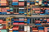 Photograph of overhead view of multi-colored shipping containers