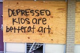 Graffiti that reads “Depressed kids are better at art”; a photo that circulated social media in the mid 2010s.