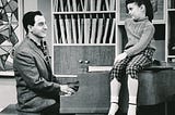 Danny Thomas plays piano for his daughter Linda, played by Angela Cartwright, seated on the piano.