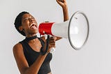 a woman shouting on a megaphone