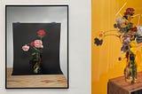 Two framed photographs of flower arrangements.