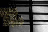[Image ID: A black and white picture with a lizard walking across a screen door. Tongues in gothic font lines across. ./End]