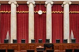 The Courtroom of the Supreme Court showing Associate Justice Ruth Bader Ginsburg’s Bench Chair in black following her death.