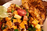 Blackened chicken with sweet potato & black bean salad mostly made in the air fryer.