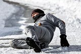 A man slipped on an icy road. He seems in pain.