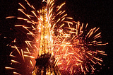 Photograph of the Eiffel Tower on New Year's 2000 we're at midnight all of the fireworks rigged in the tower exploded into a colossal gigantic kaboom. Copyright © 2000 by Andrew Somers. all rights reserved