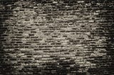 A wall of black and grey bricks