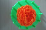 Picture of marigold made with wool ( made and picture captured by author Lalitha Brahma)