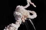 Challenger space ship exploding, white ribbons of smoke