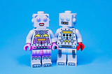 Picture shows two lego robots side by side