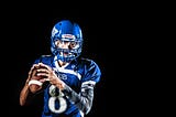 A quarterback getting ready to make a pass