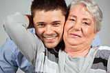 older woman hugging young man