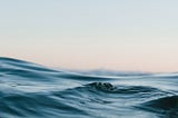 Body of water under sky. Photo by Matt Hardy via Unsplash.