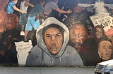 Mural of Trayvon Martin along with symbols of despair in East New York, Brooklyn.