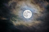 Brilliant full moon on a cloudy night