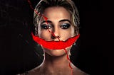 Promotional image for Smile 2 of the protagonist, Skye Riley, with a red smile slashed through the photograph where her mouth would be.
