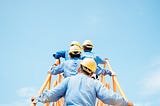 Construction workers with protective hats