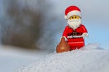 A fierce looking Lego Santa Claus in the snow