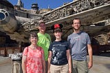 My family stands in front of the Millenium Falcon