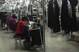 Women sewing jeans in a Chinese factory.