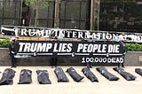 ACTIVISTS DELIVER BODY BAGS On The Steps of NYC’s Trump Hotel, Protesting Trump and the GOP’s Lack…