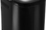 Black, plastic Amazon Essentials bread machine against a white background.