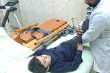 Physiotherapy session of a school Kid in a local hospital of Pakistan.