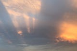 Long shadows in clouds at sunset