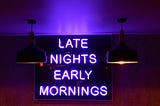 Neon sign with the text “Late Nights, Early Mornings”