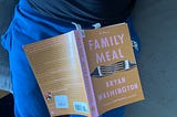 Family Meal, by Bryan Washington, sat in author’s lap