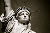 What is America About? Emma Lazarus’ poem, The New Colossus, reminds us …