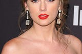 Taylor swift in a black sleeveless dress