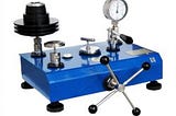 What is the purpose of a deadweight tester?