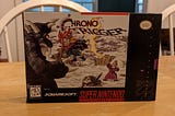 A photo of the original box for Chrono Trigger on the Super Nintendo game system.