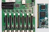 A Pine64 clusterboard next to a SOPINE SO-DIMM compute module