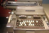 A Flexowriter, which is a machine resembling a typewriter used to generate punched ASCII code tapes for use in early computers and numerically controlled machine tools.