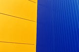 Photo from Ikea of a yellow and blue wall meeting at the middle.
