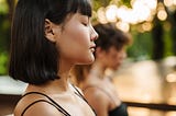 woman close her eyes in mindfulness meditation