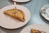 Hand pies with a birthday candle