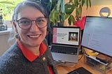 Picture of the author at her desk with computer screens