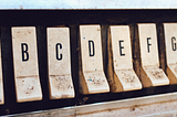 Jukebox buttons with letters printed on them.