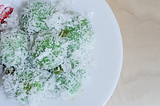 ondeh ondeh a kueh with coconut shavings and a gula melaka filling